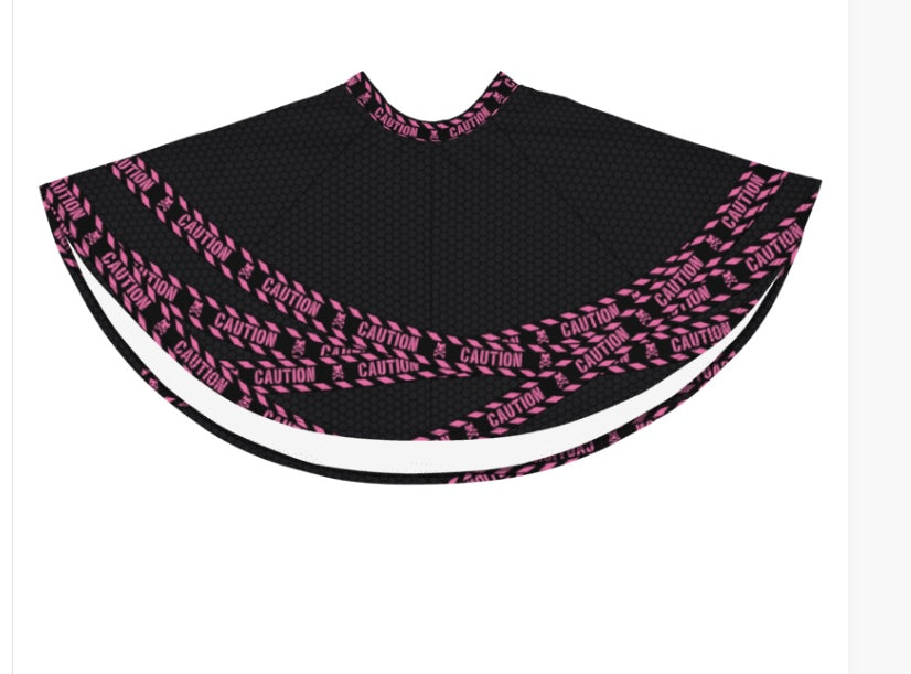 Image displays the skirt front lying flat, showing the hot pink and caution tape pattern 