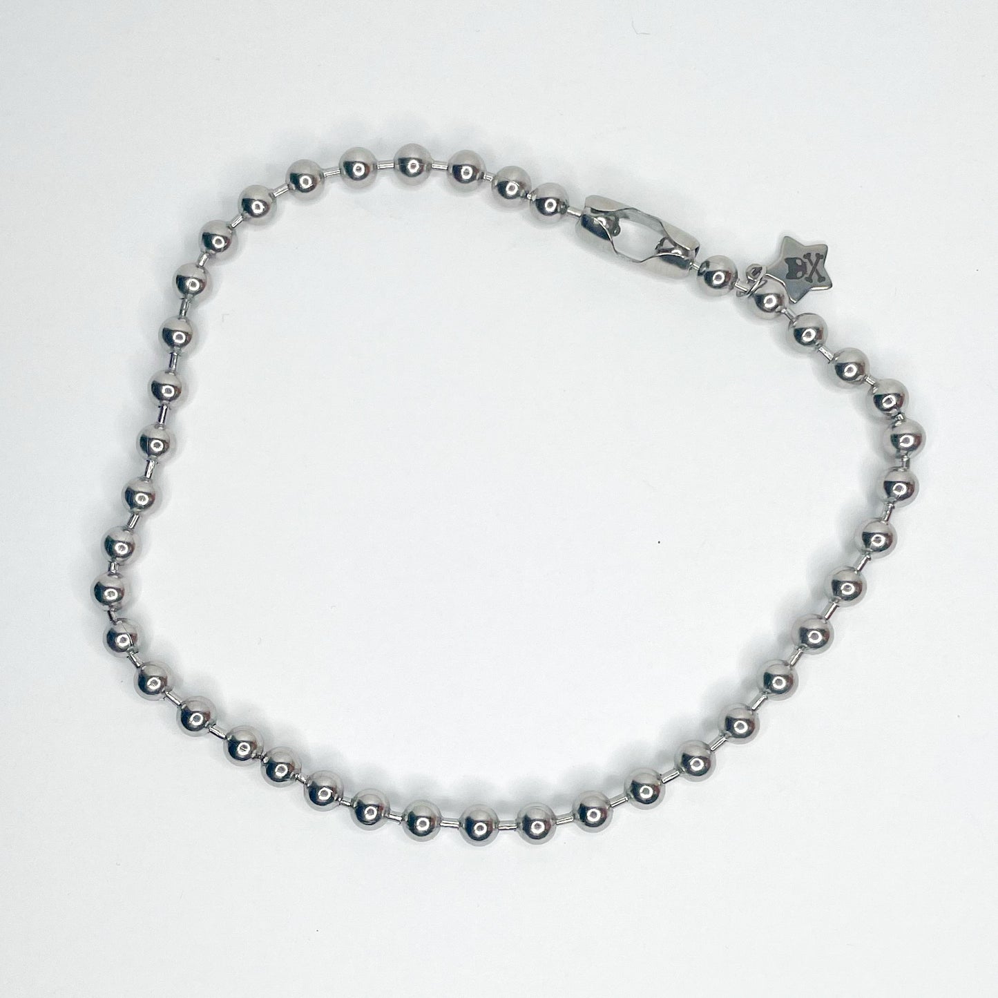 Image shows chunky silver 8 millimeter ball chain necklace against a white background 