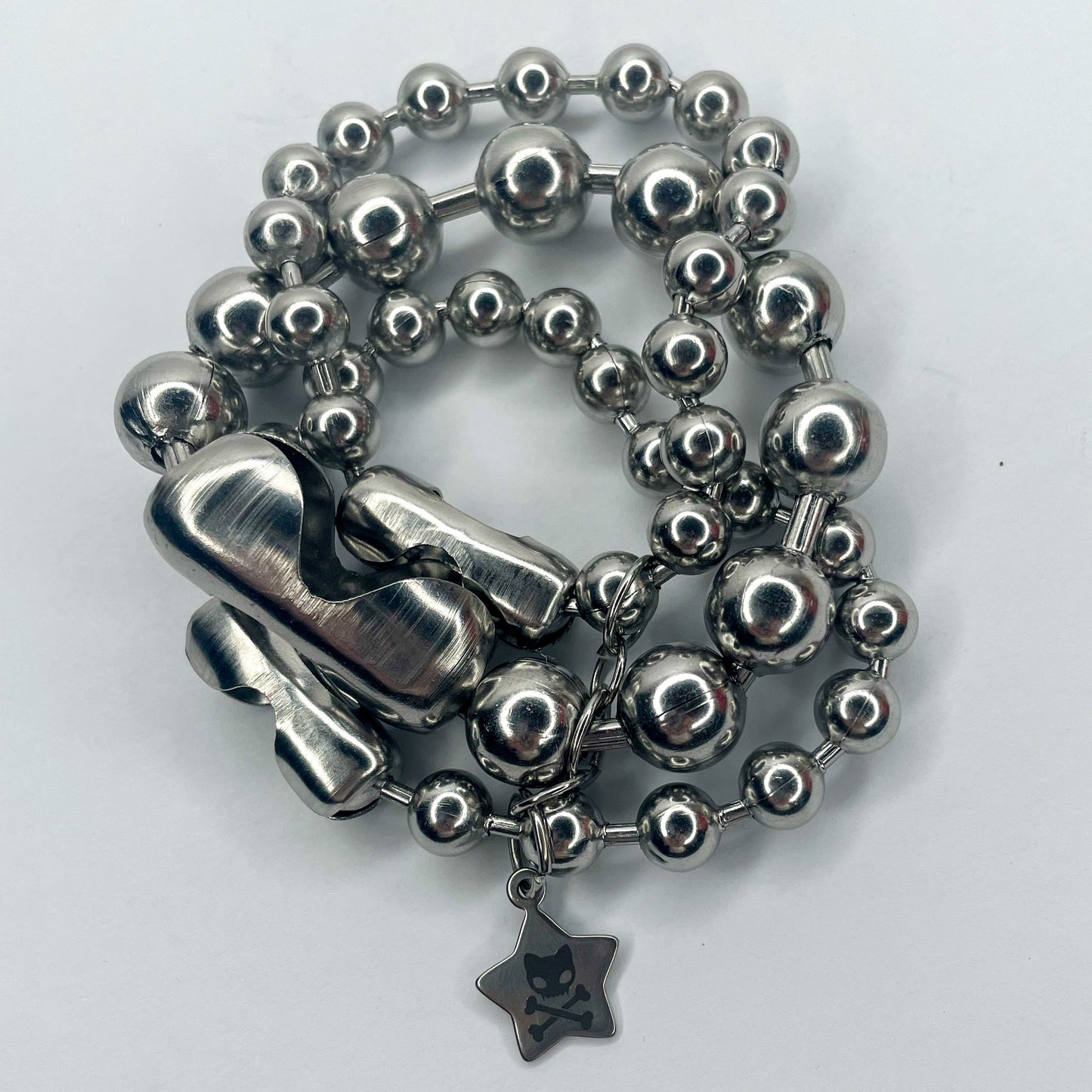 Image shows closeup of layers of varying sizes of ball chain 