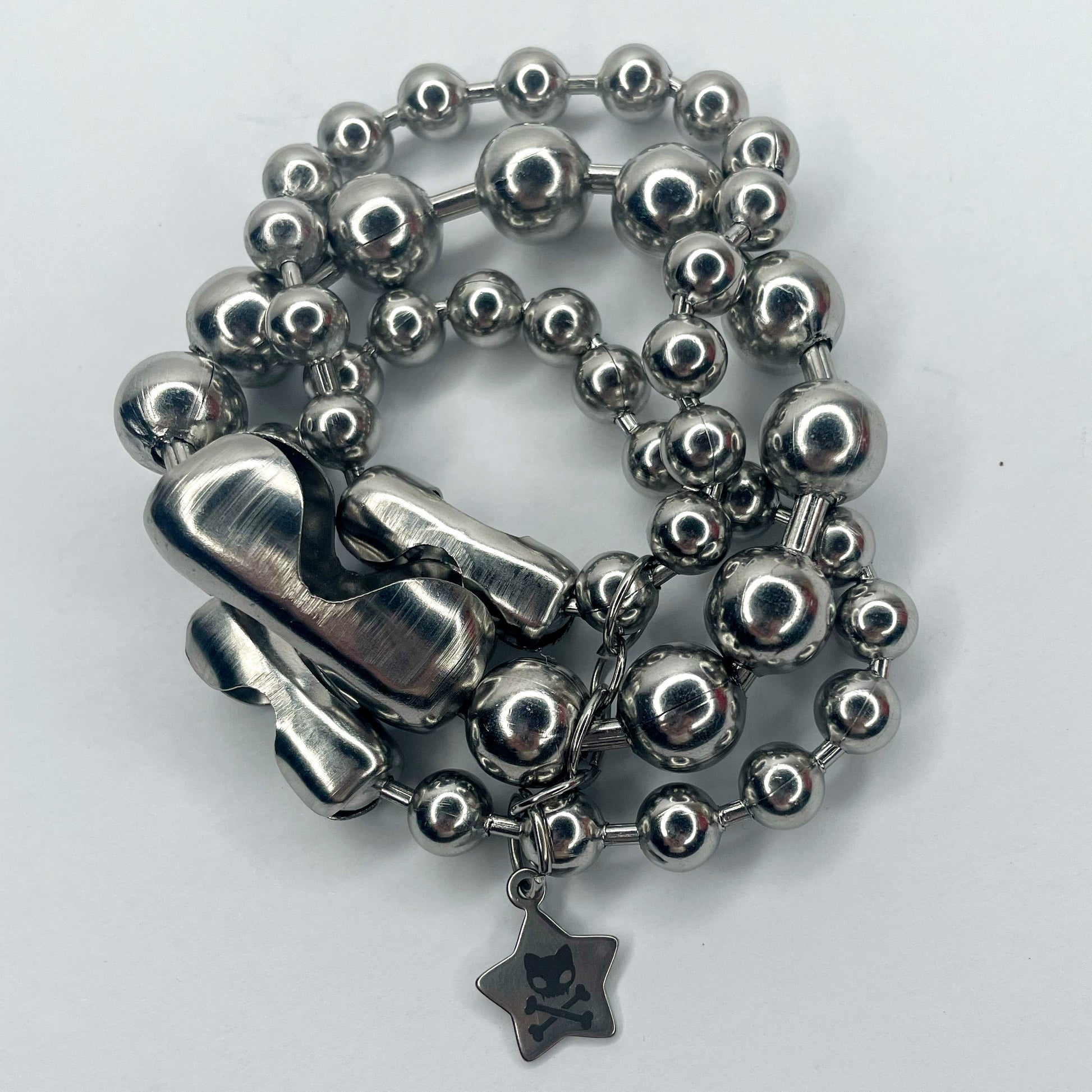 Image shows closeup of layers of varying sizes of ball chain 