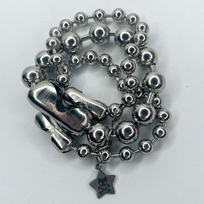 Image shows closeup of layers of varying sizes of ball chain 