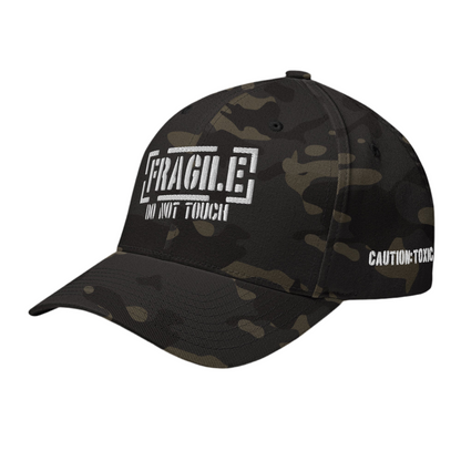 This black camp closed back trucker cap has an embroider FRAGILE do not touch in white  on the front, with a small white Caution:Toxic logo on the back.