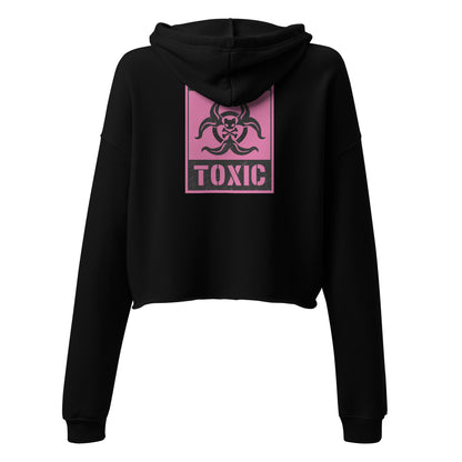 Back of the black cropped hoodie is a graphic of a hot pink caution toxic sign 